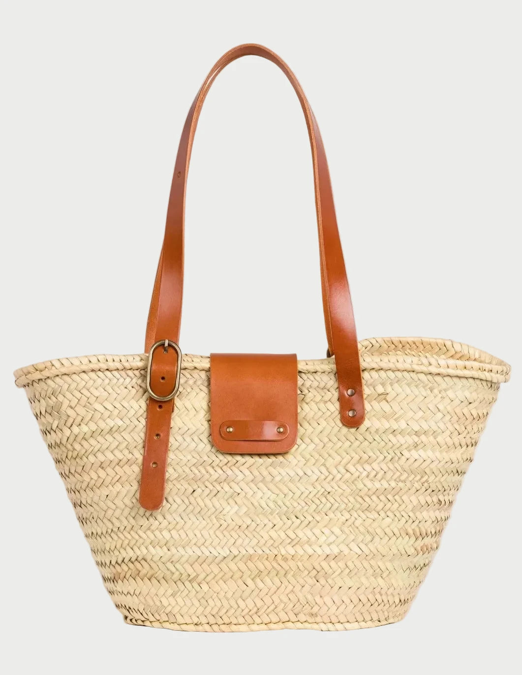Aicha palm leaf basket bag with light brown calfskin leather handles and front flap closure