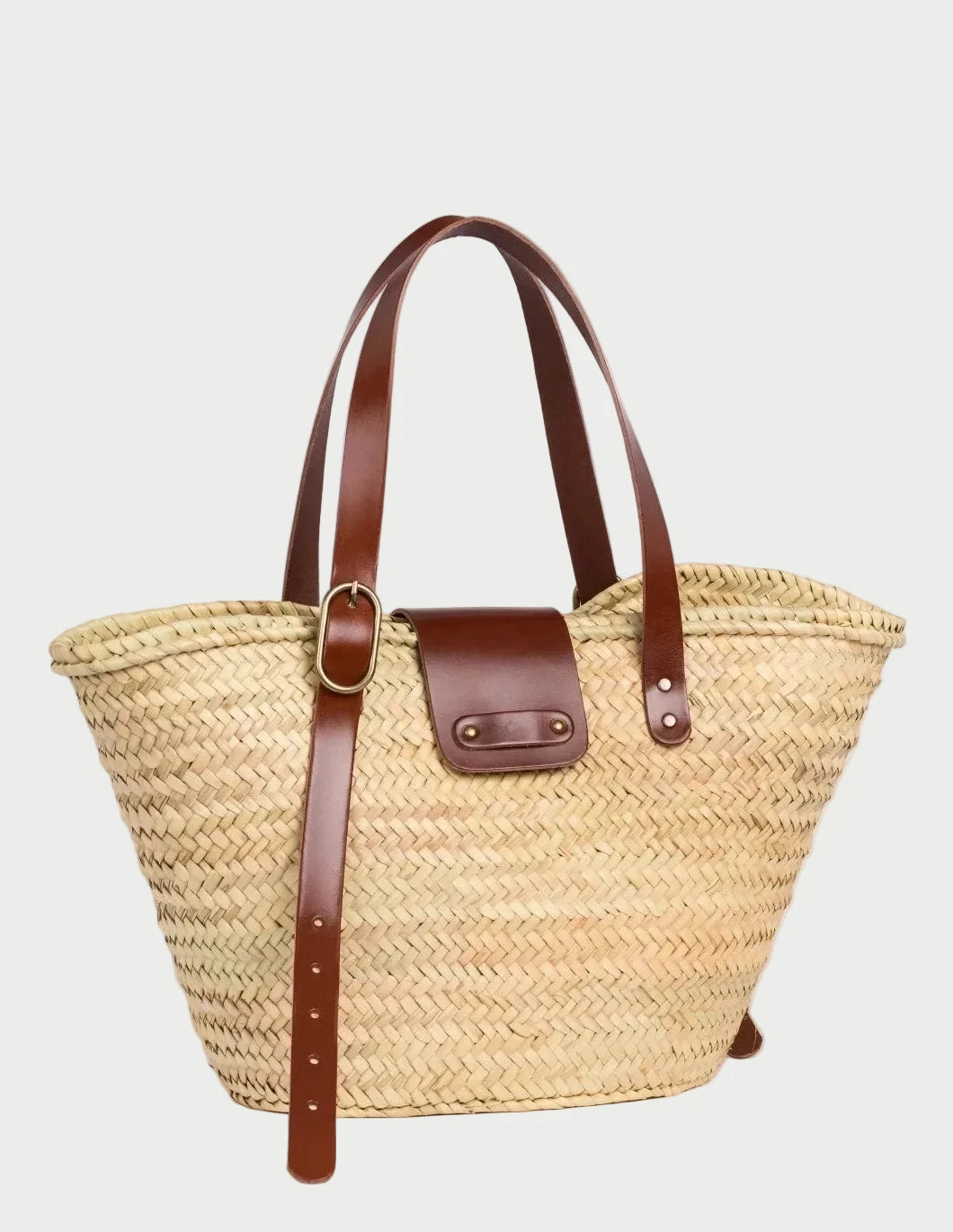 Front view of Aicha palm leaf shopper basket bag with dark brown leather flap and buckle detail
