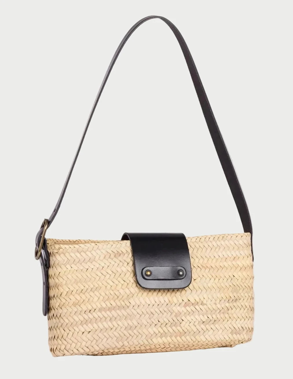 Asmae palm leaf baguette bag with black calfskin trim, three-quarter angle