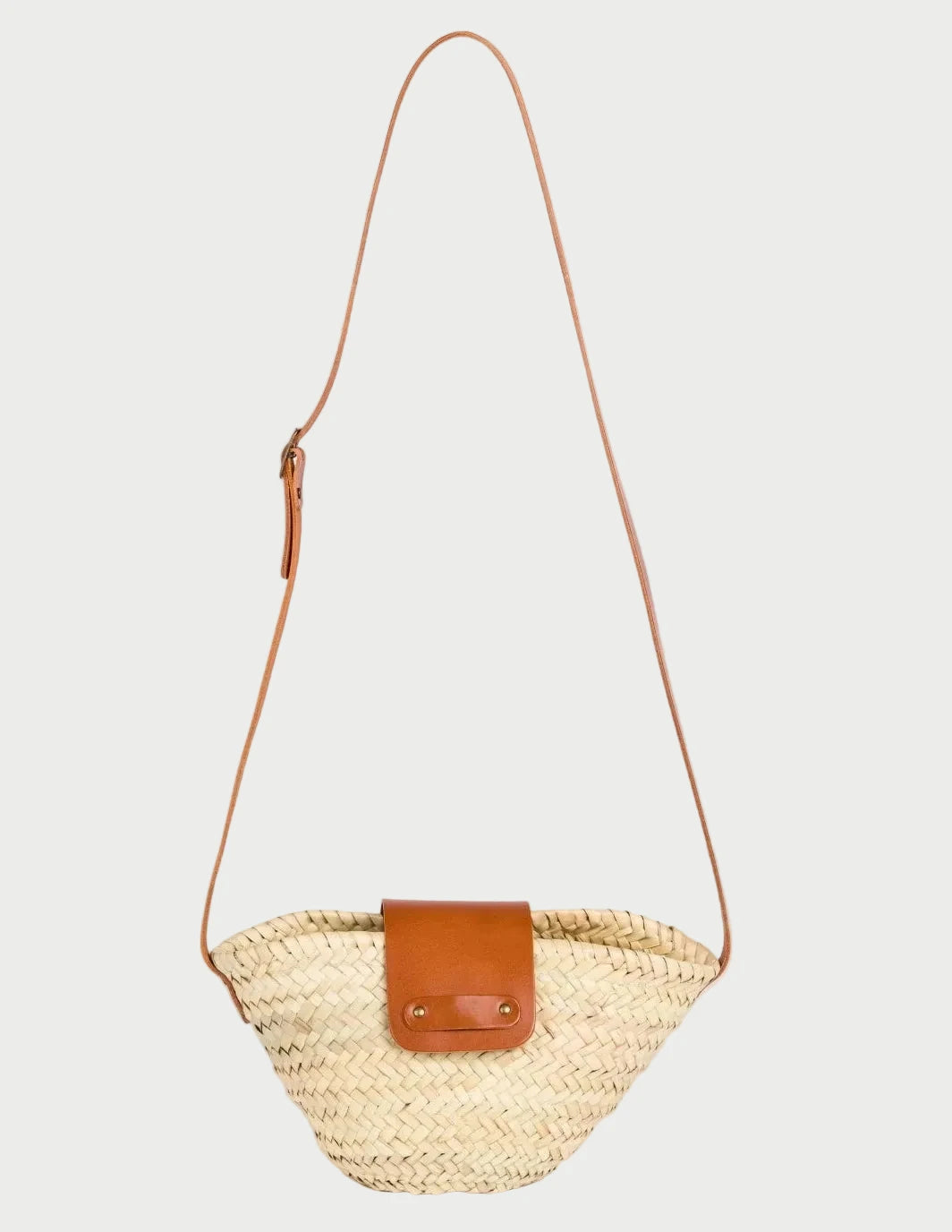 Dija Crossbody palm leaf basket bag with light brown calfskin strap and flap, front view