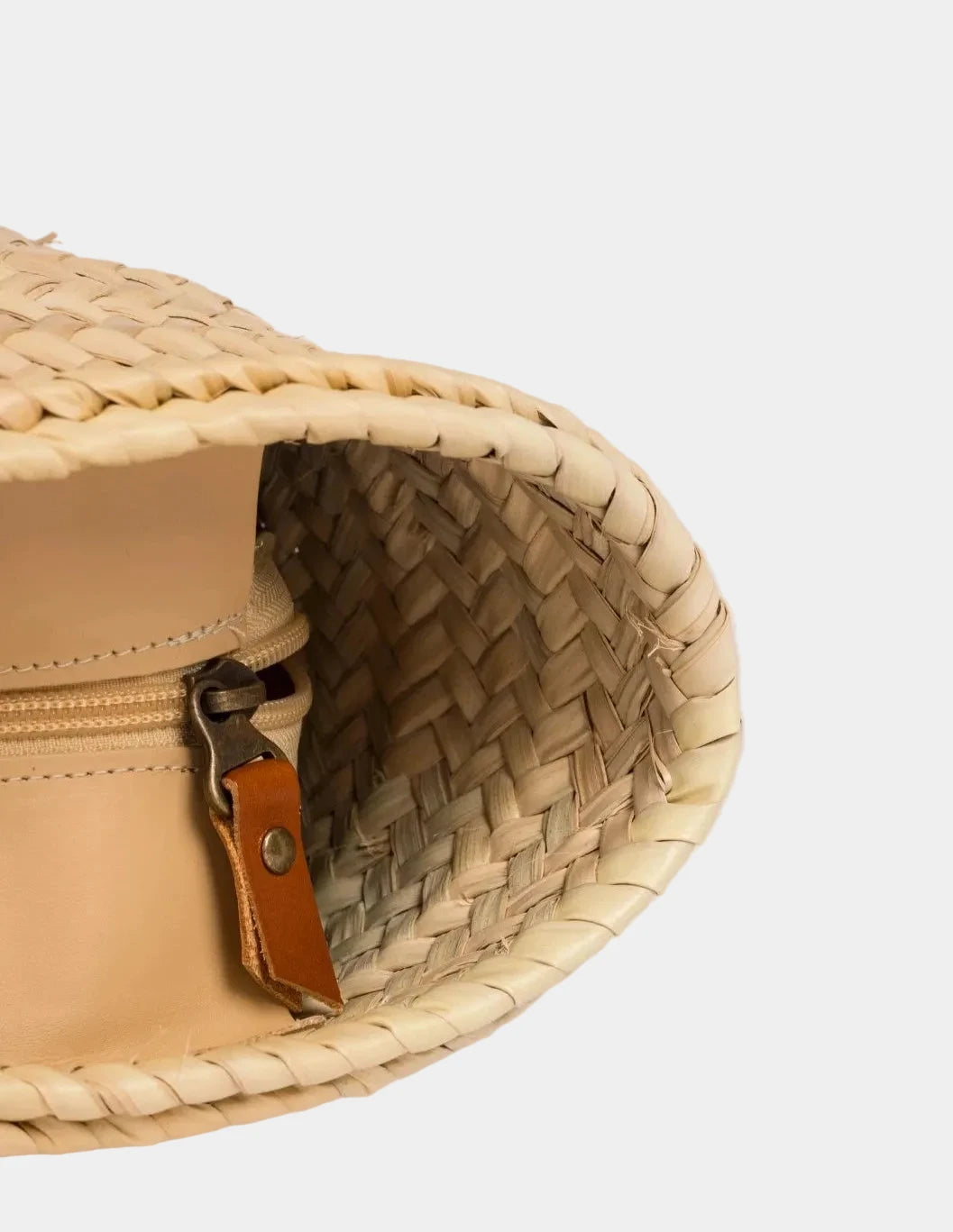 Inside view of the spacious Fadma Large palm leaf basket bag #color_light brown