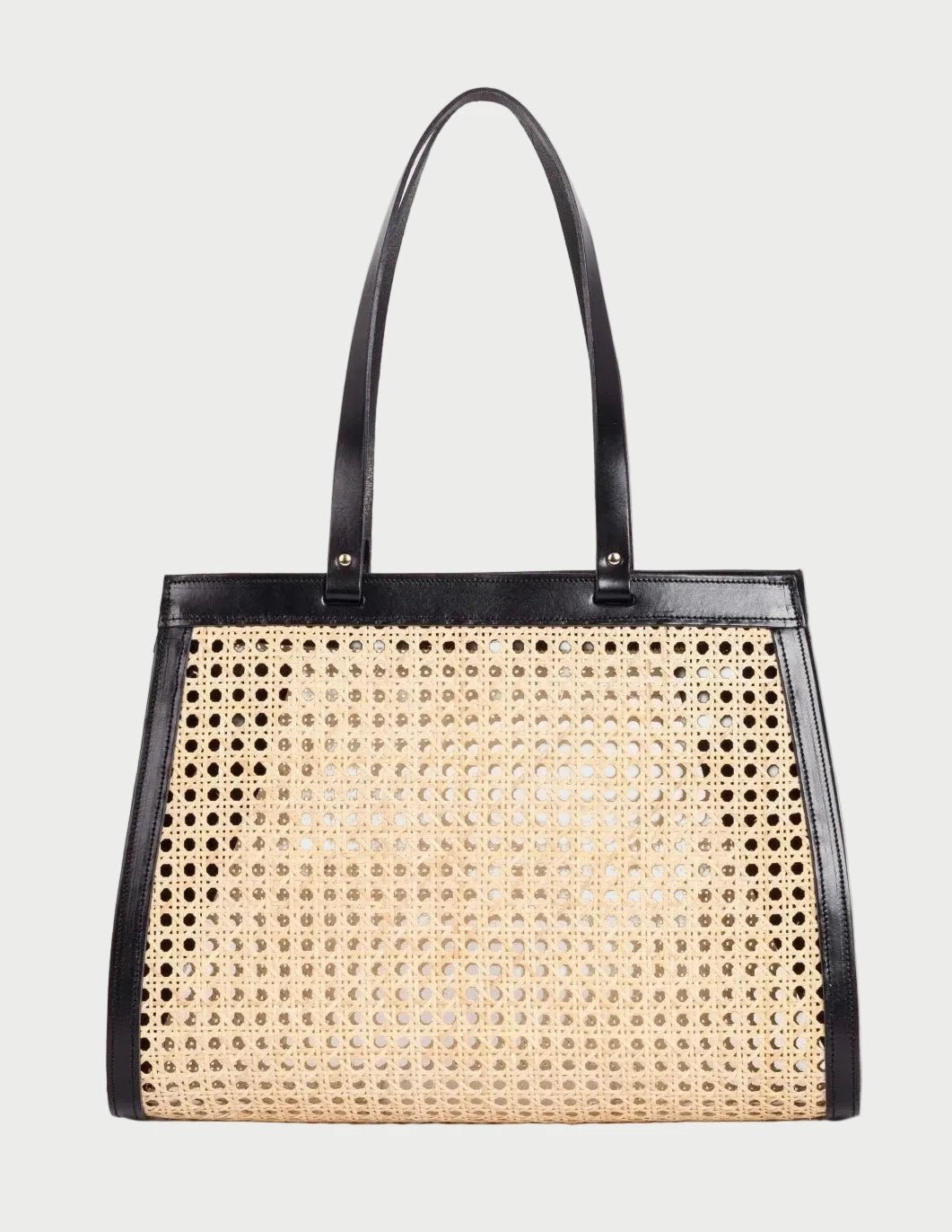 Lamia Cane Tote in natural rattan with black leather frame and twin handles, front view