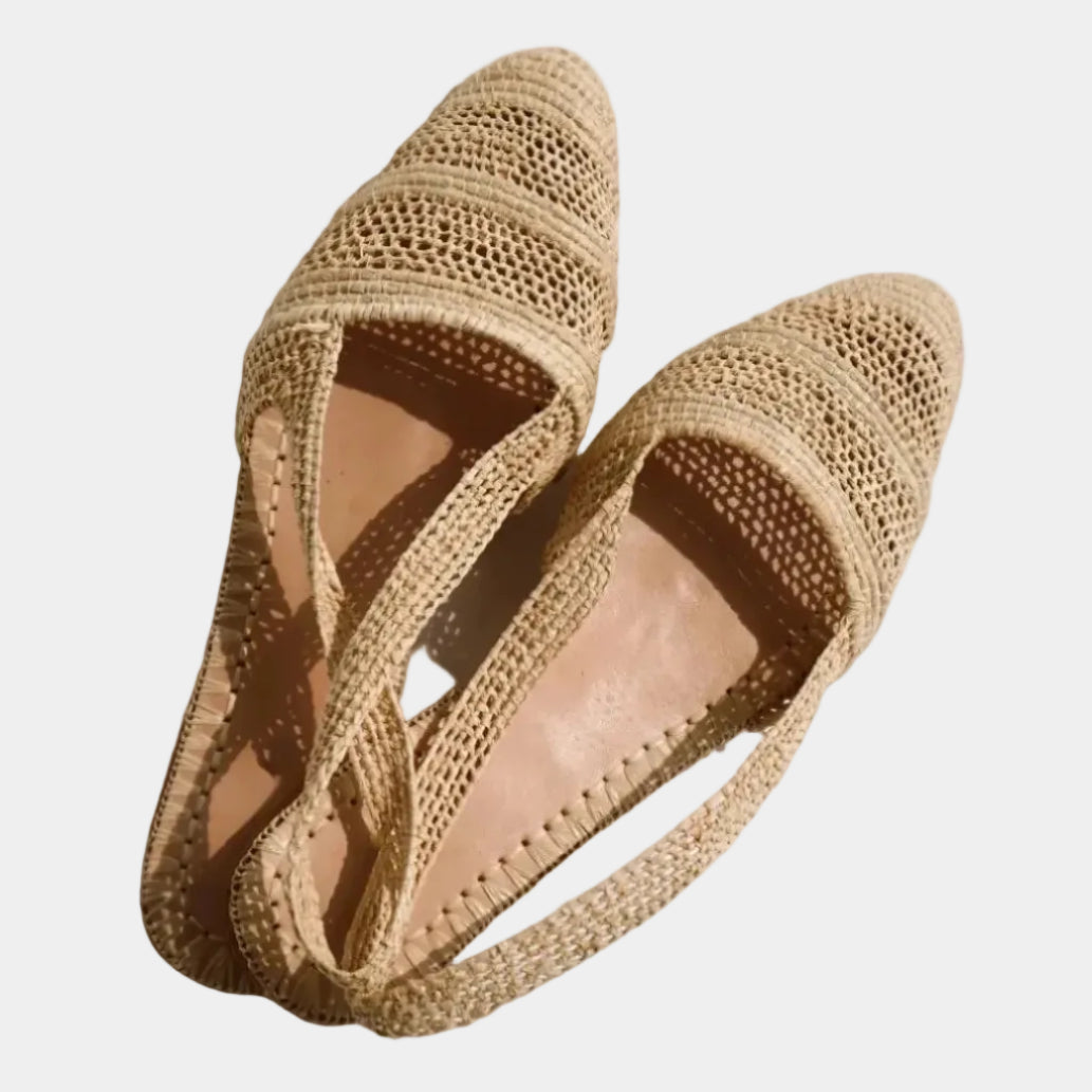 Top view of Naima raffia slingback flats showing open crochet weave and leather insole