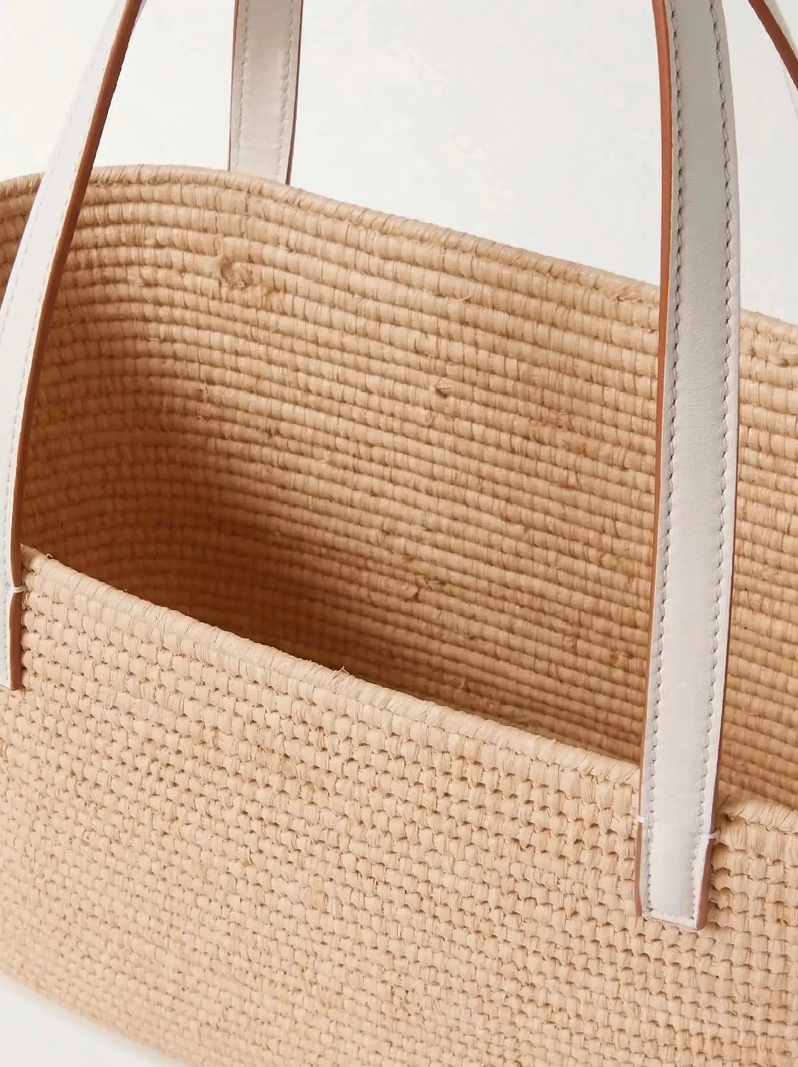 White raffia Yasmine Tote with white calfskin straps, three-quarter angle