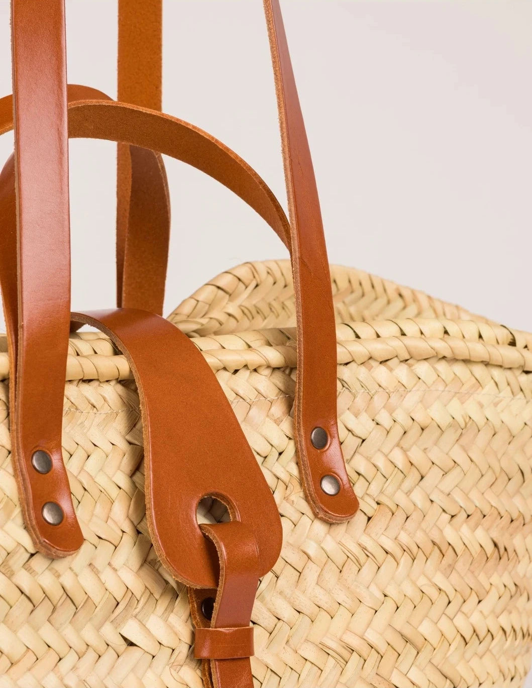 Close-up of the light brown calfskin front strap and trim on the Zhour Large