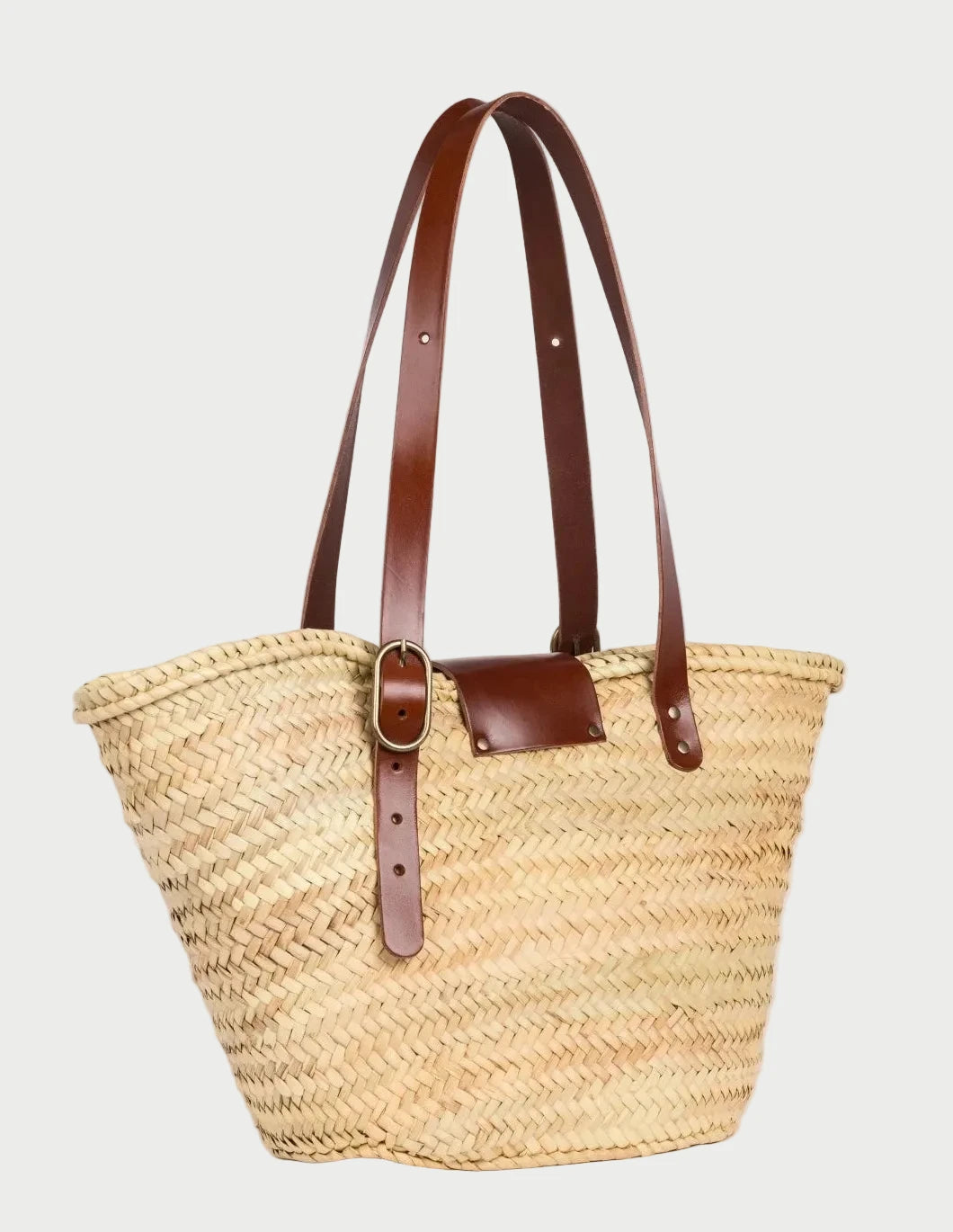 Back view of Aicha Moroccan palm leaf basket bag with dark brown calfskin leather handles
