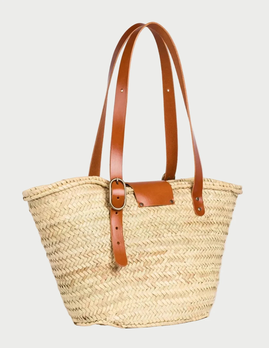 Back view of Aicha Moroccan palm leaf basket bag with light brown calfskin leather handles