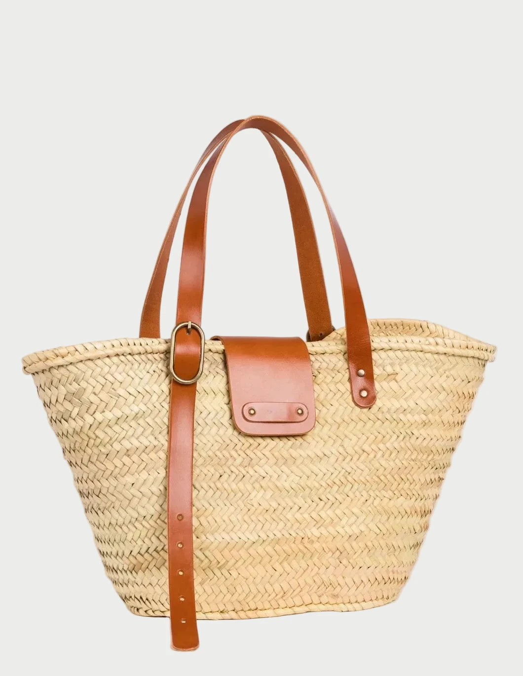 Front view of Aicha palm leaf shopper basket bag with light brown leather flap and buckle detail