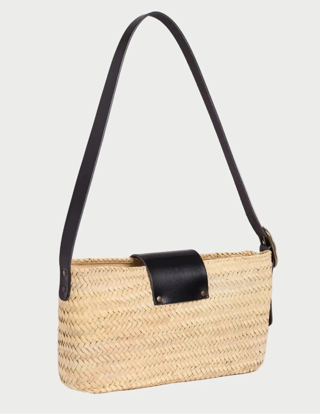 Side view of the Asmae Baguette Bag showing the adjustable black calfskin strap