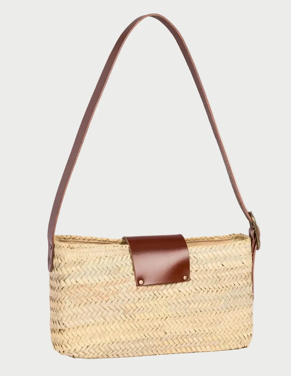 Asmae palm leaf baguette bag with dark brown calfskin trim, rear three-quarter angle