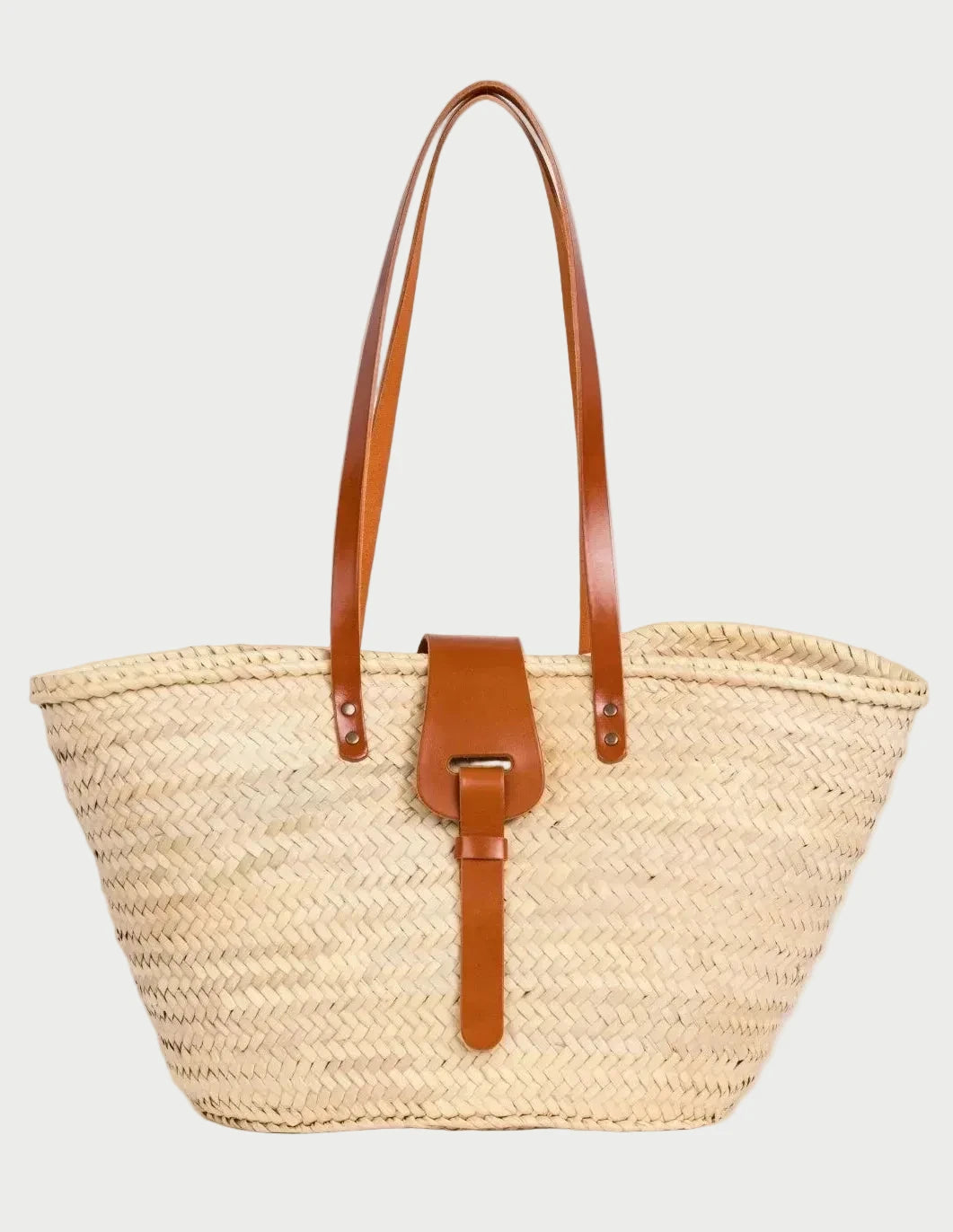 Fadma Large palm leaf basket bag with light brown calfskin handles and shoulder straps, front view