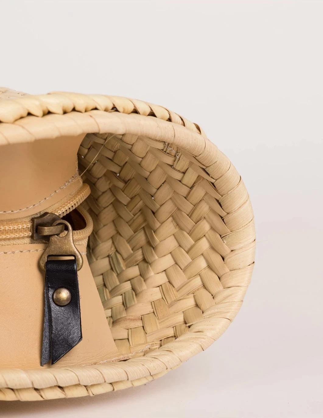 ide view of the Fadma Small basket bag in palm leaf with black calfskin straps
