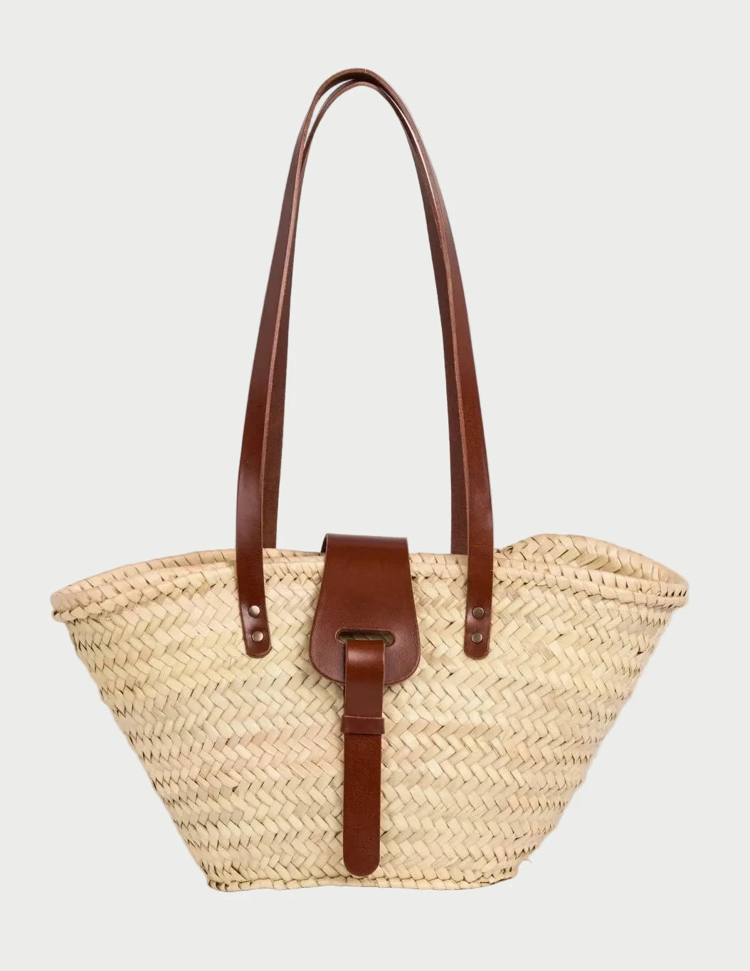 Fadma Small palm leaf basket bag with dark brown calfskin handles and shoulder straps, front view