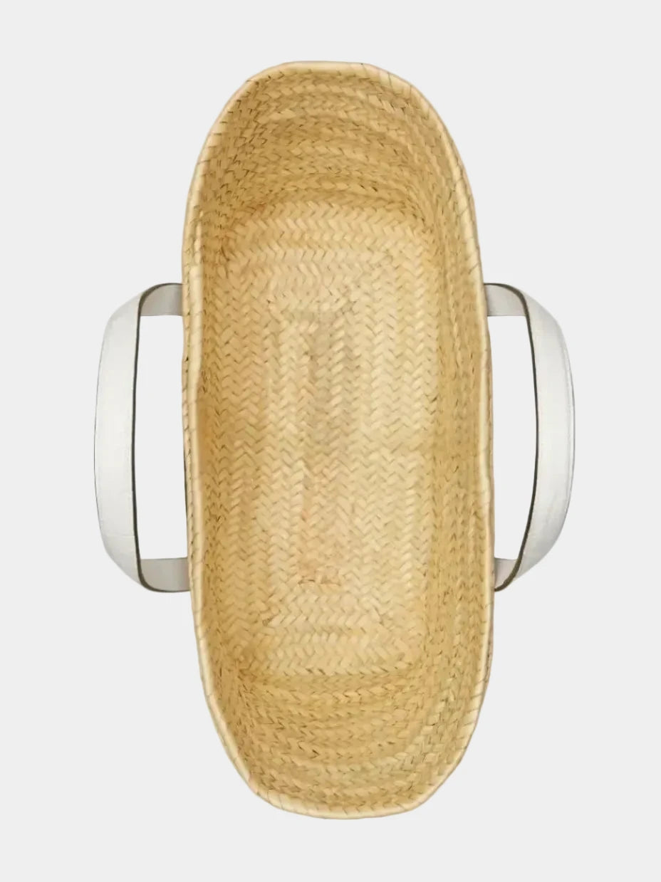 Top view of Malika basket tote in white showing open interior and woven palm base