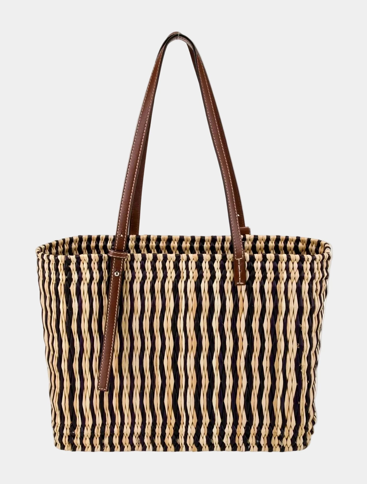 Dark brown striped hand-woven basket tote with leather straps on white background