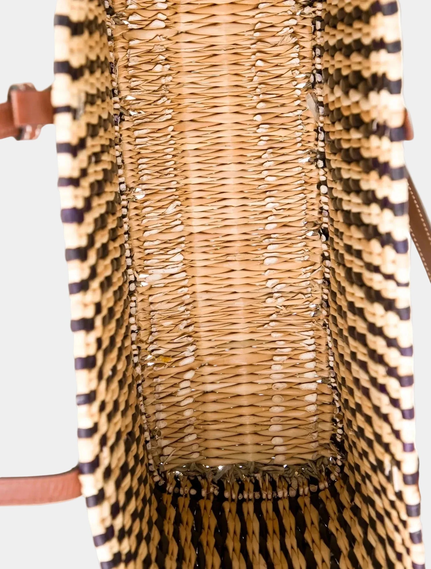 Overhead view of Ghita dark brown basket tote showing open top and unlined interior