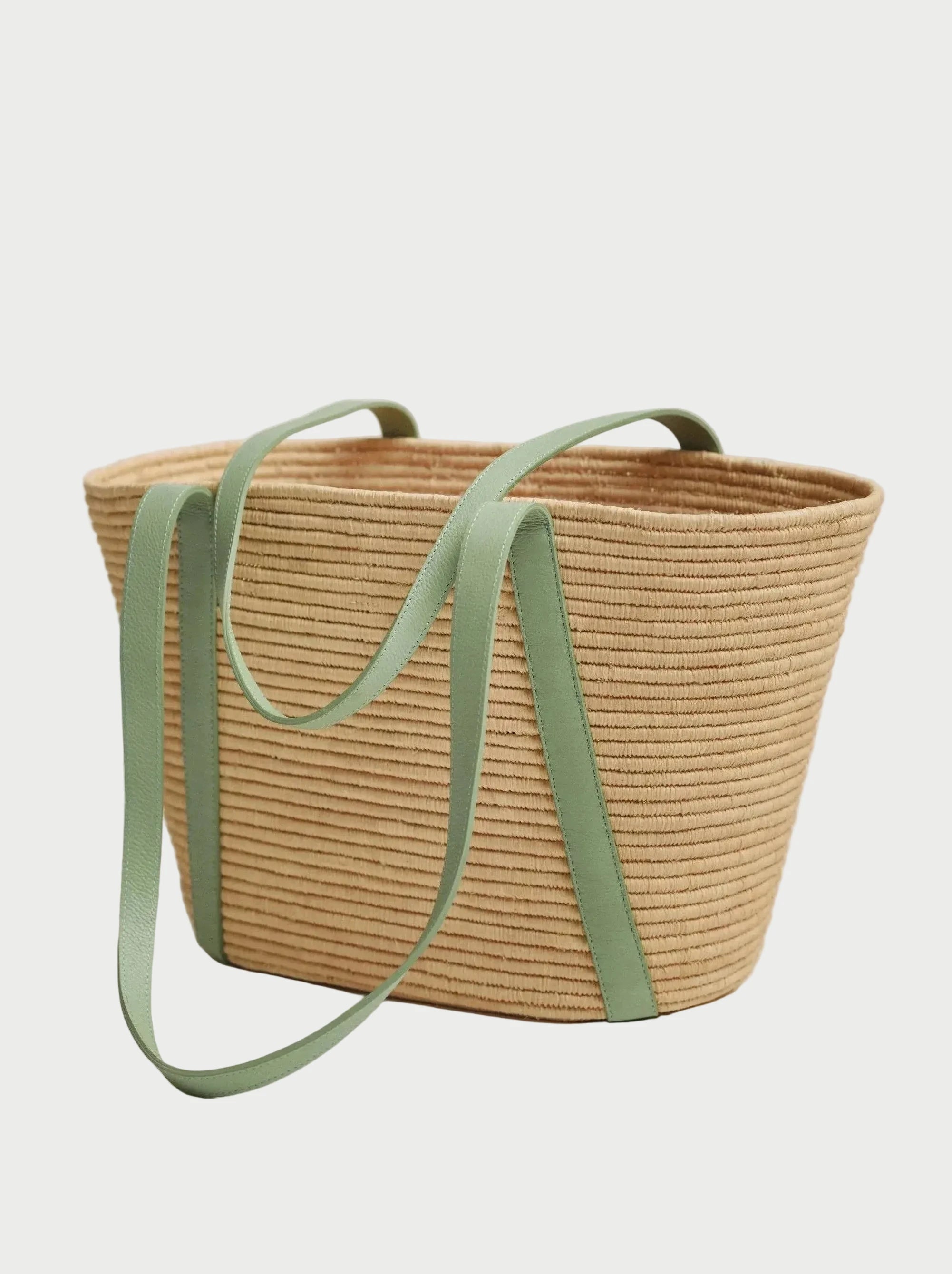 Open interior of the Kenza raffia basket tote showing unlined woven structure