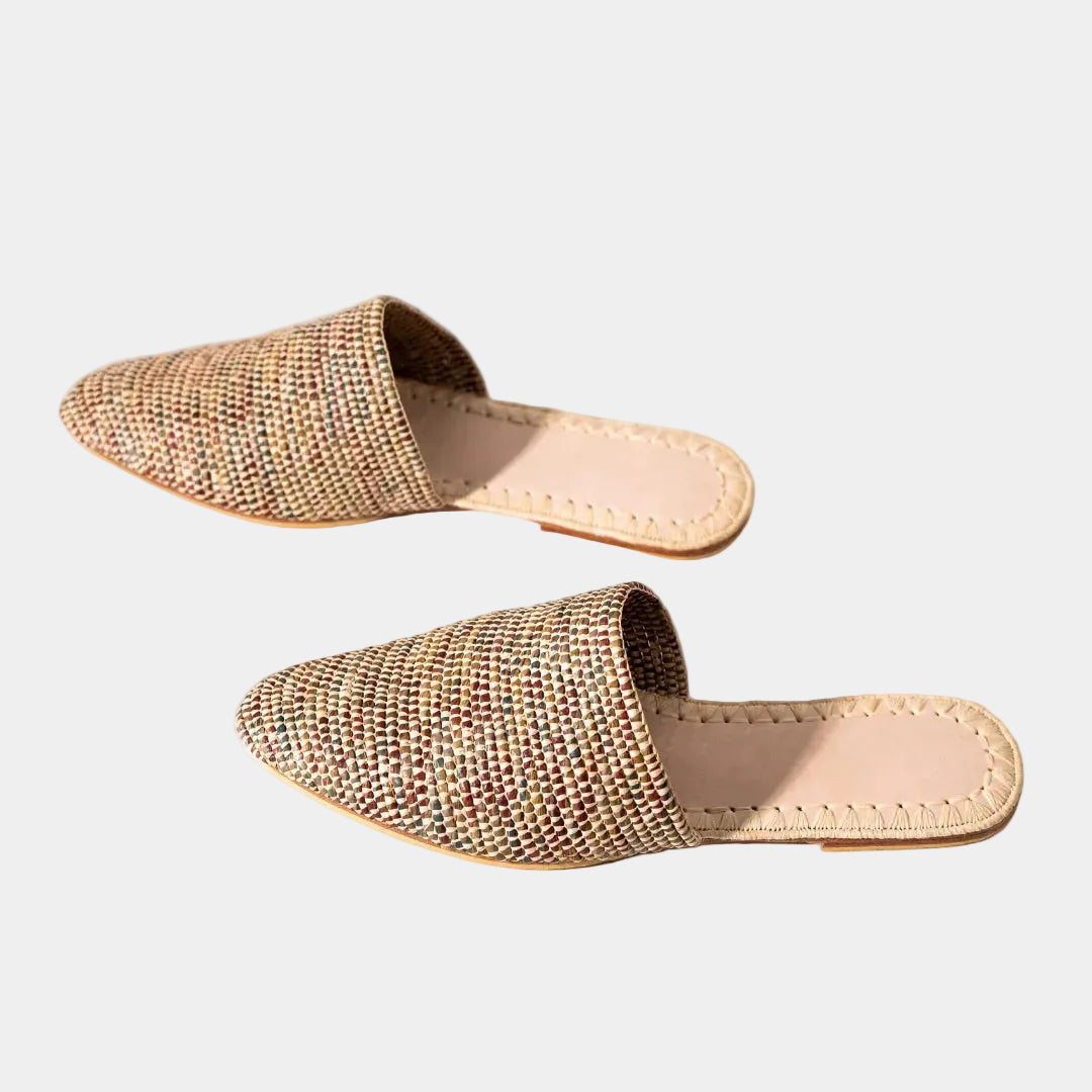 Pair of speckled raffia babouche mules shown at an angle — Tilila mule in Mix by MARRAVIE
