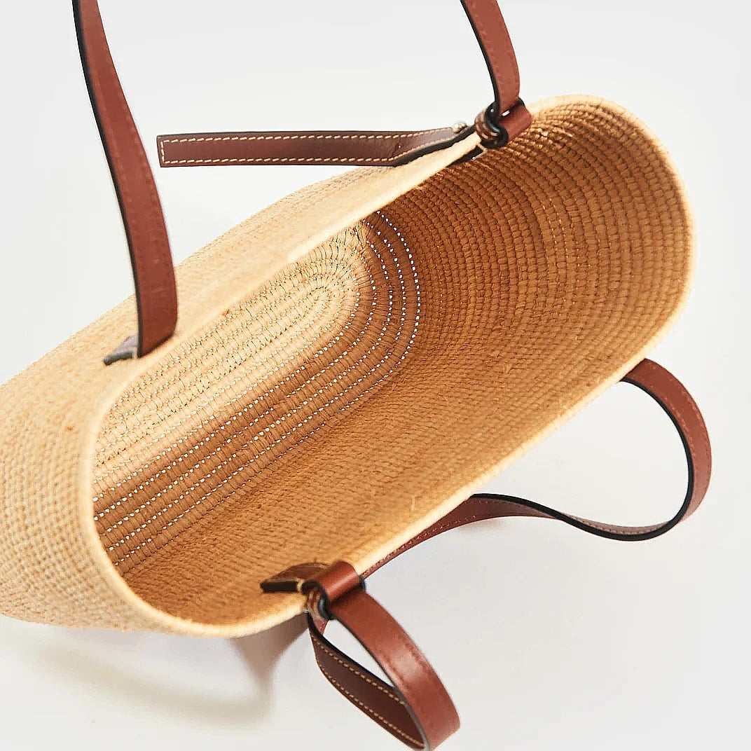 Open-top view of the brown Yasmine Raffia Tote showing the woven raffia interior