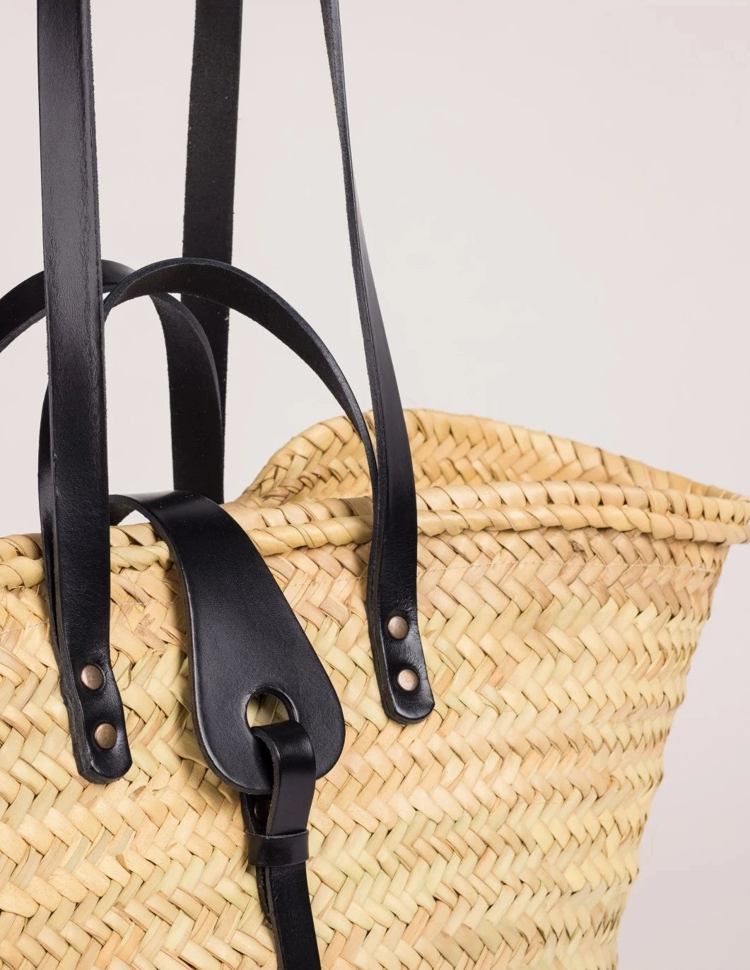 Close-up of the blackcalfskin front strap and trim on the Zhour Large